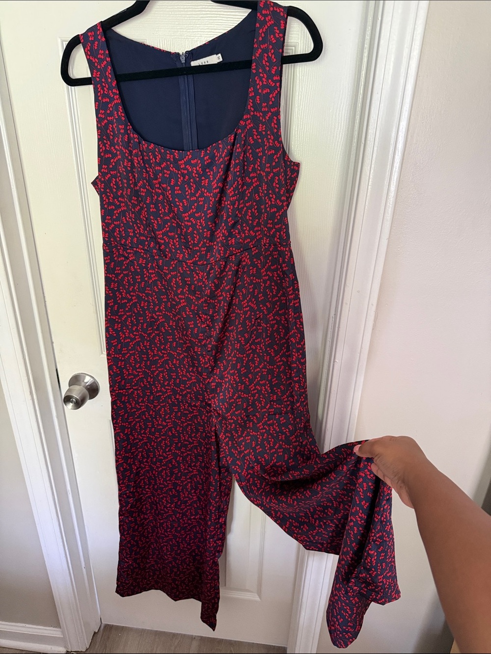 Sleeveless Navy Jumpsuit with Red Floral Print